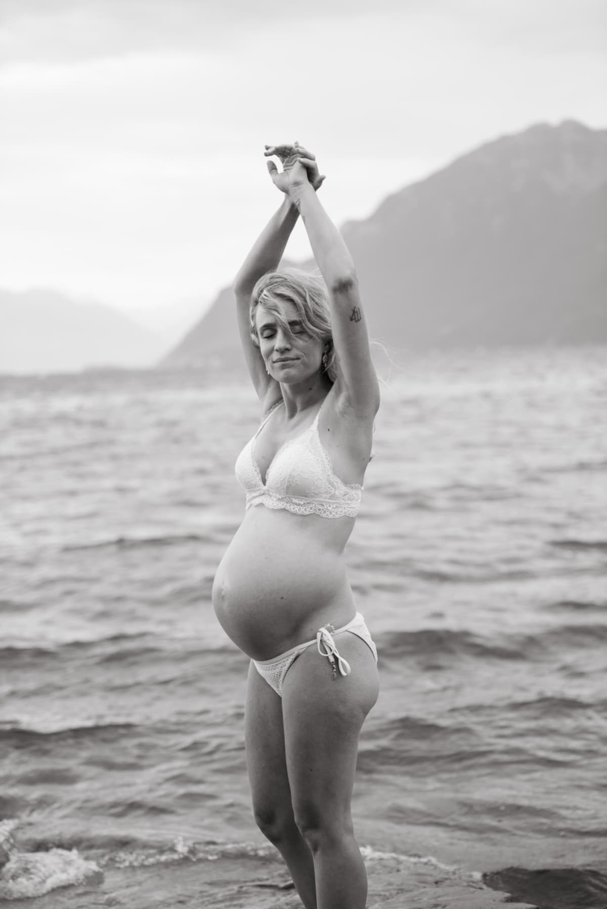A quiet moment between a mother, the water and everything that is about to change.