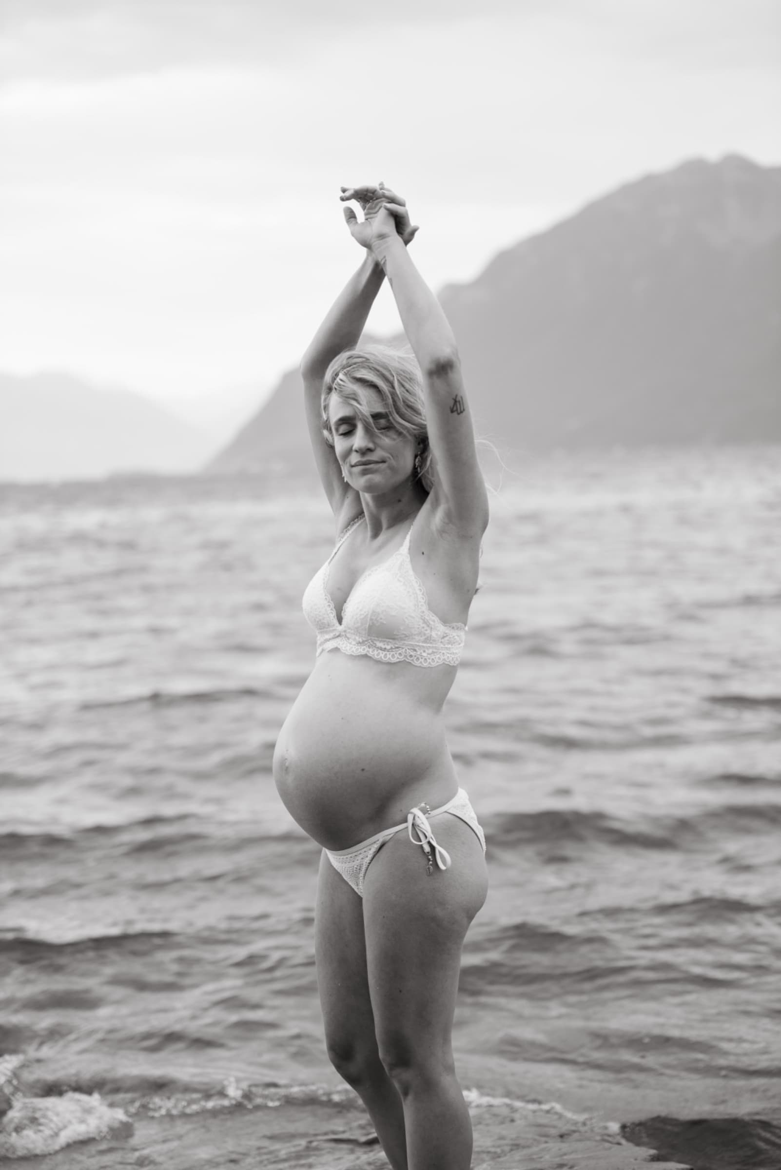 A quiet moment between a mother, the water and everything that is about to change.
